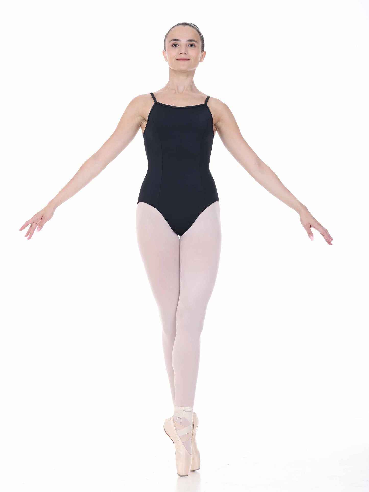 Ballerina in a black leotard and white tights on a white background
