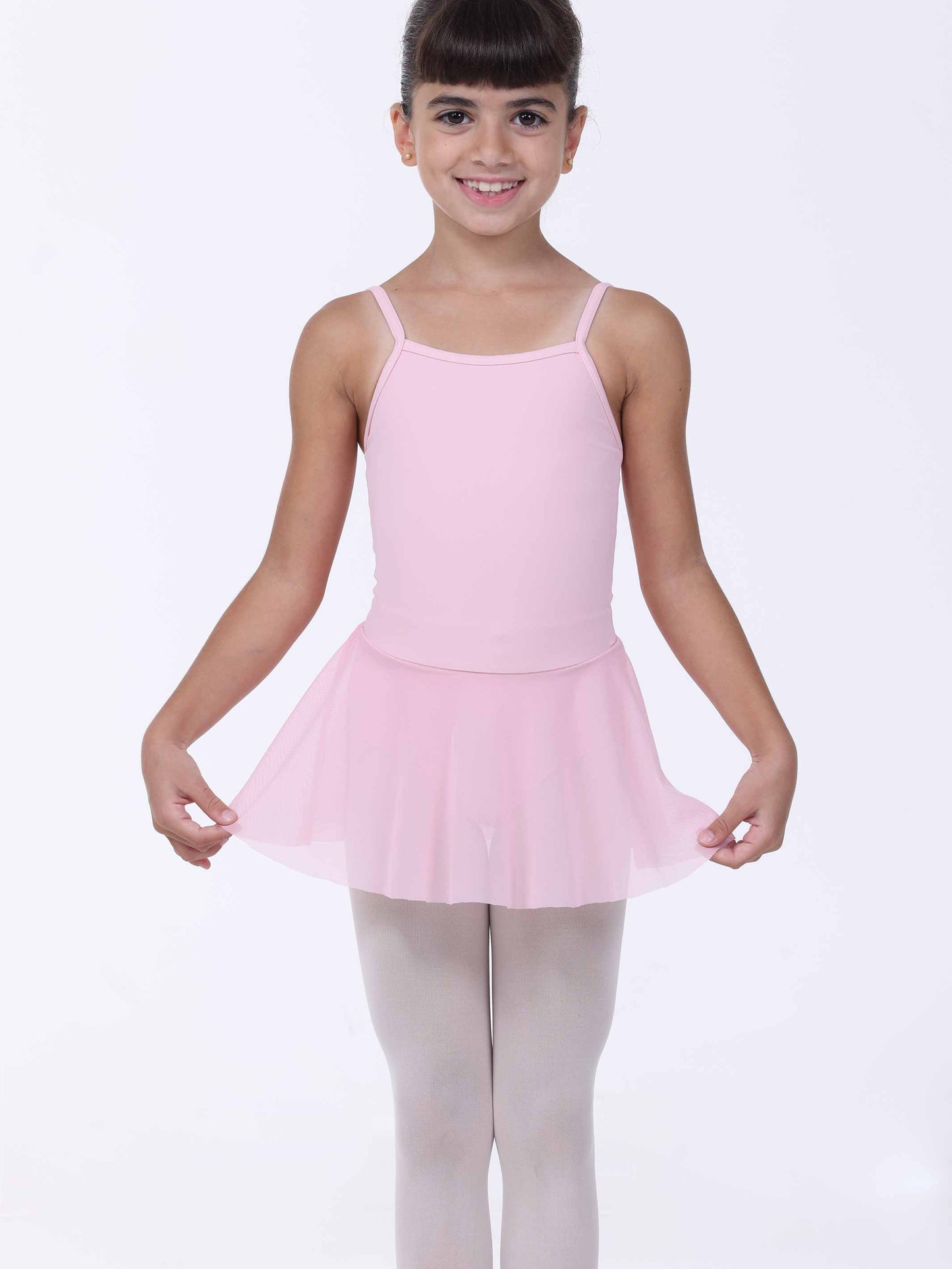 Young girl wearing a pink dress with a white background
