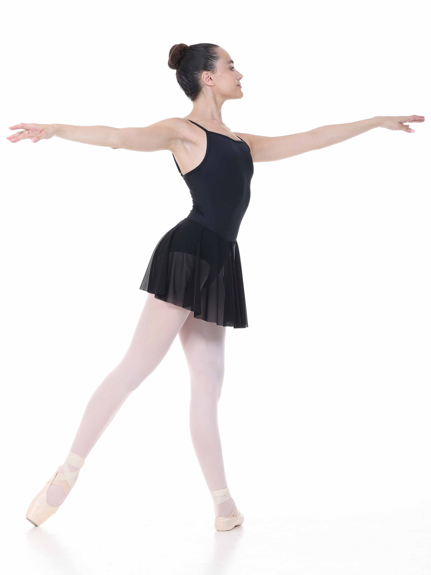 Ballerina in a black ballet dress on a white background