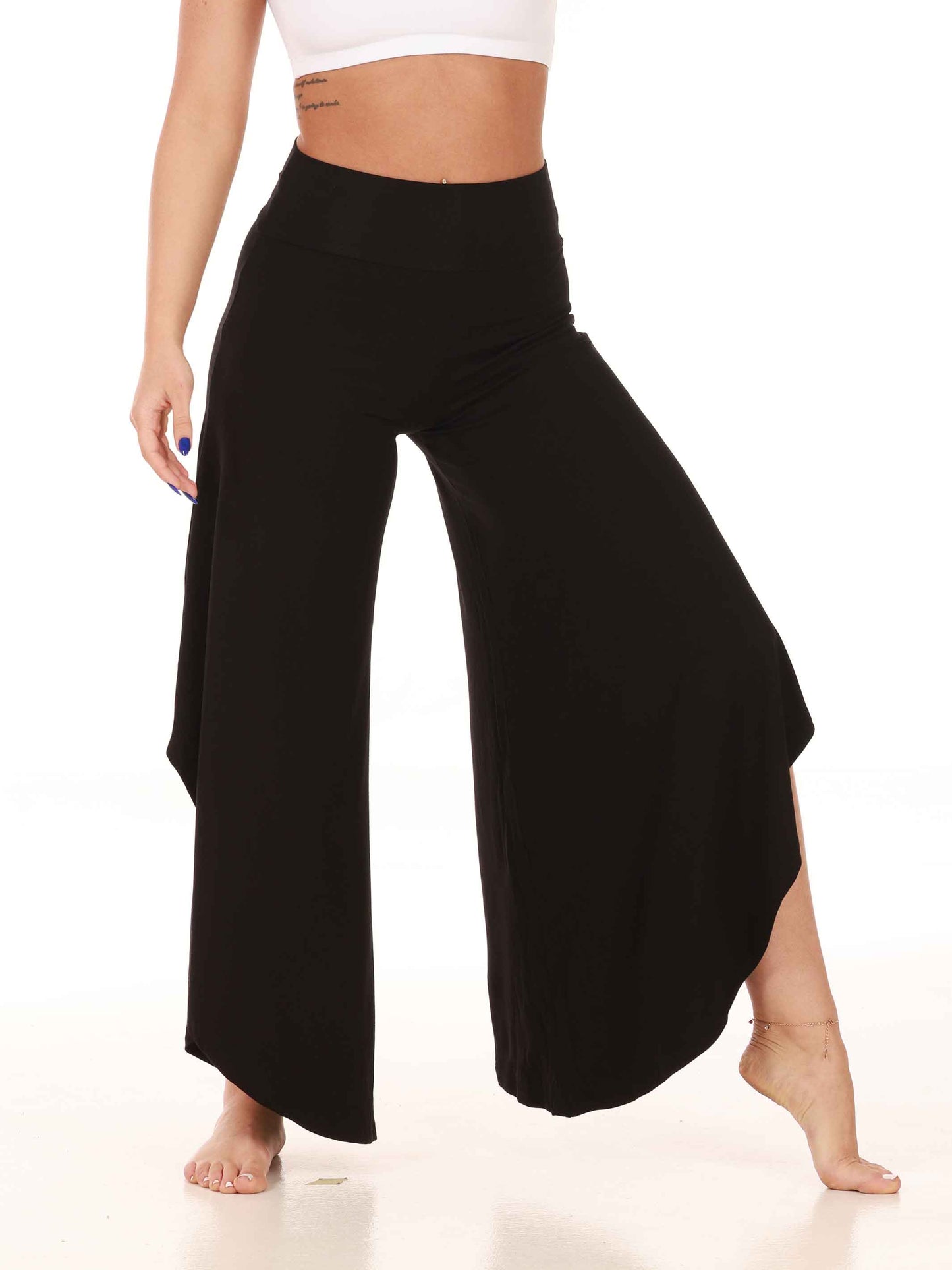 Black wide-leg jazz pants worn by a person on a white background