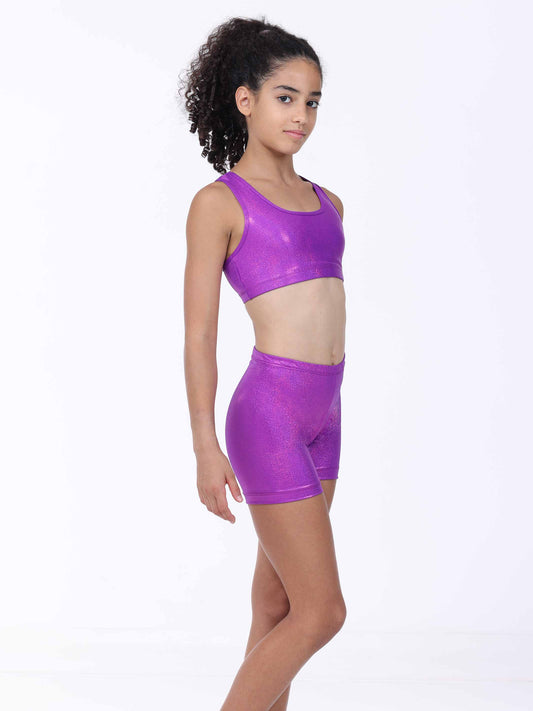Person wearing a purple sports bra and shorts set on a white background