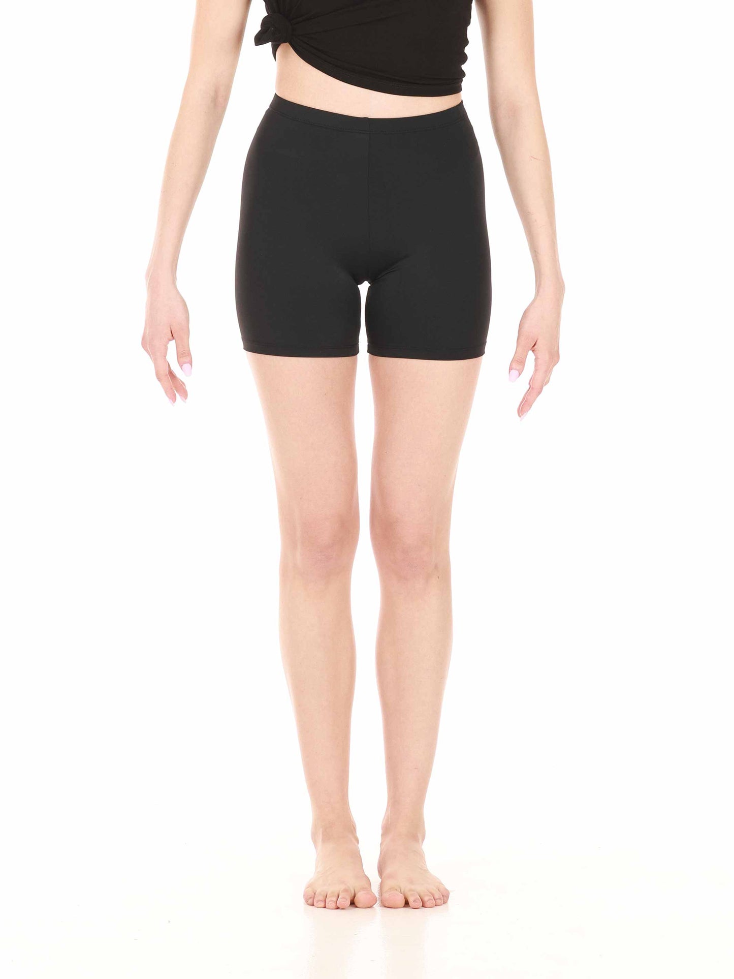 Black high-rise shorts worn by a person on a white background