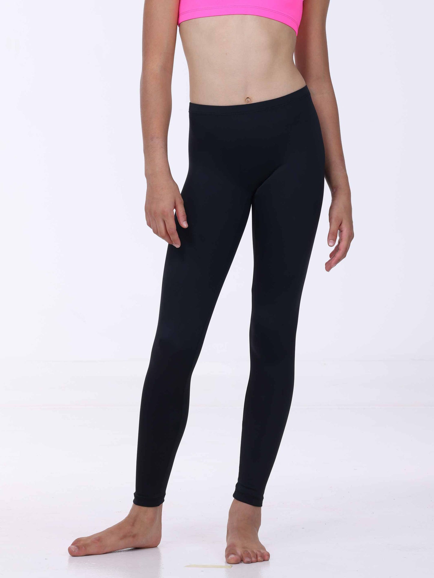 Person wearing black leggings on a white background
