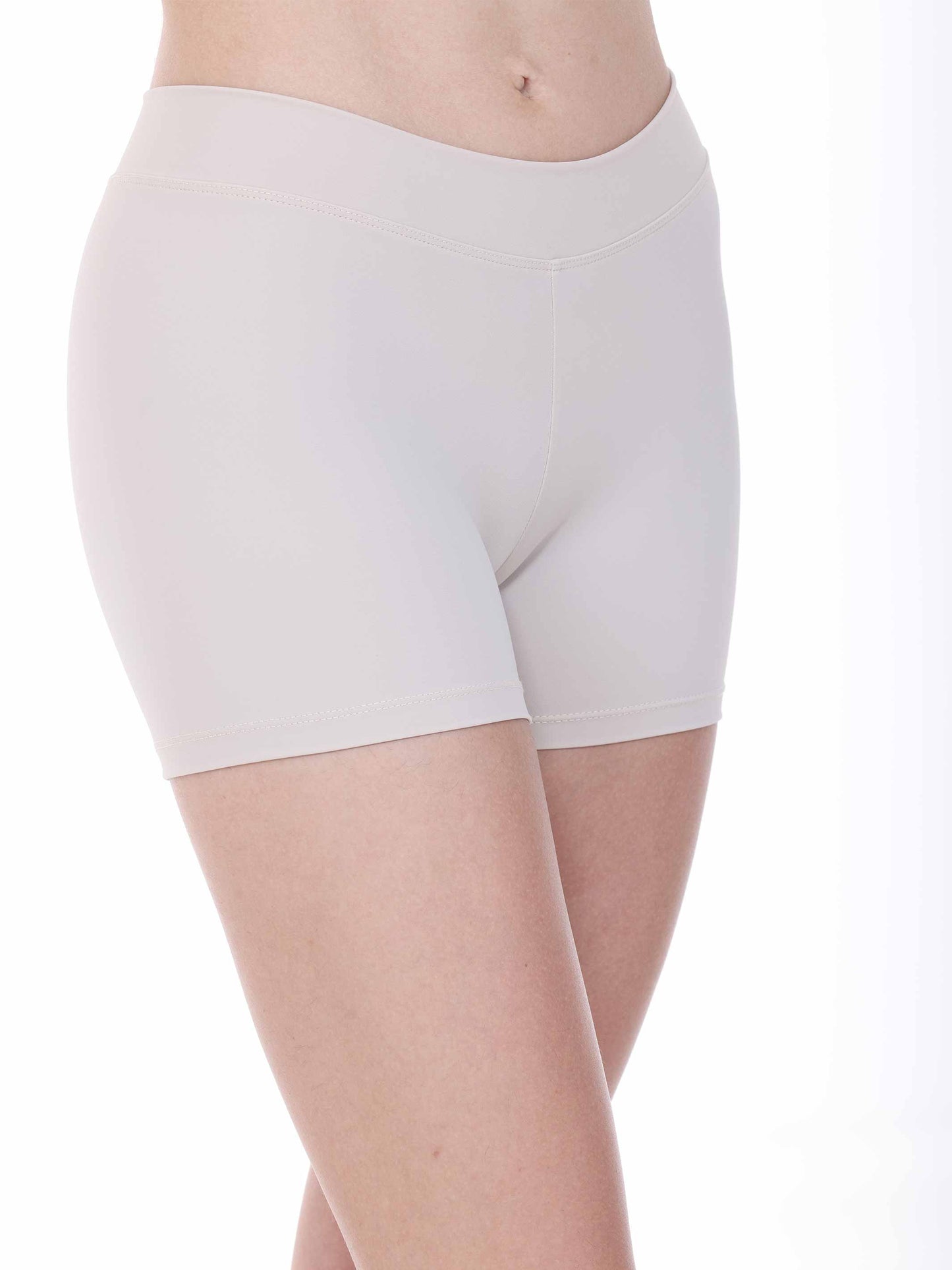 Nude yoga shorts worn by a person on a white background