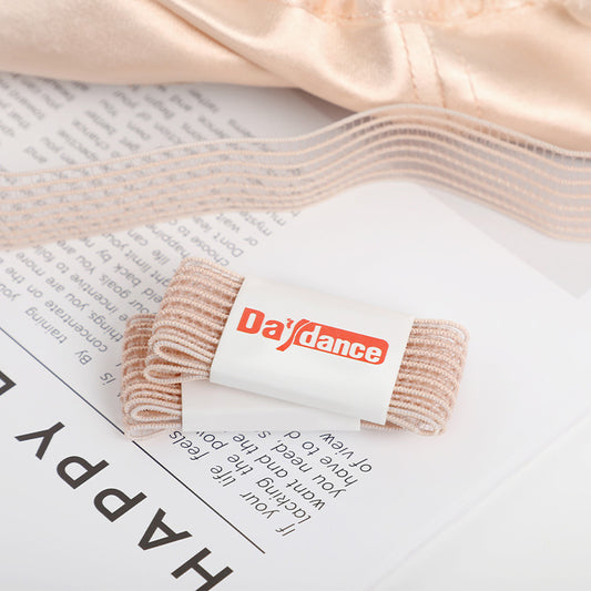 Pack of Elastic Ribbon for Pointe shoes on newspaper background