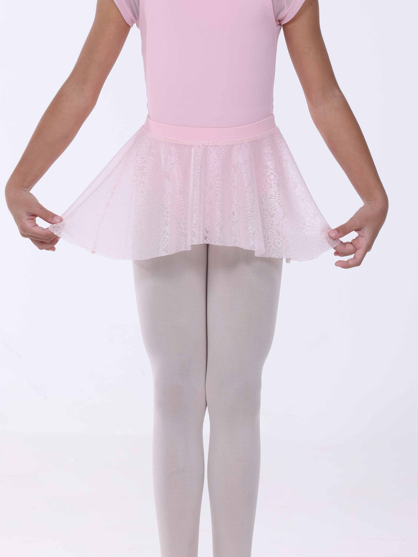 Girl wearing a pink ballet lace skirt on a white background