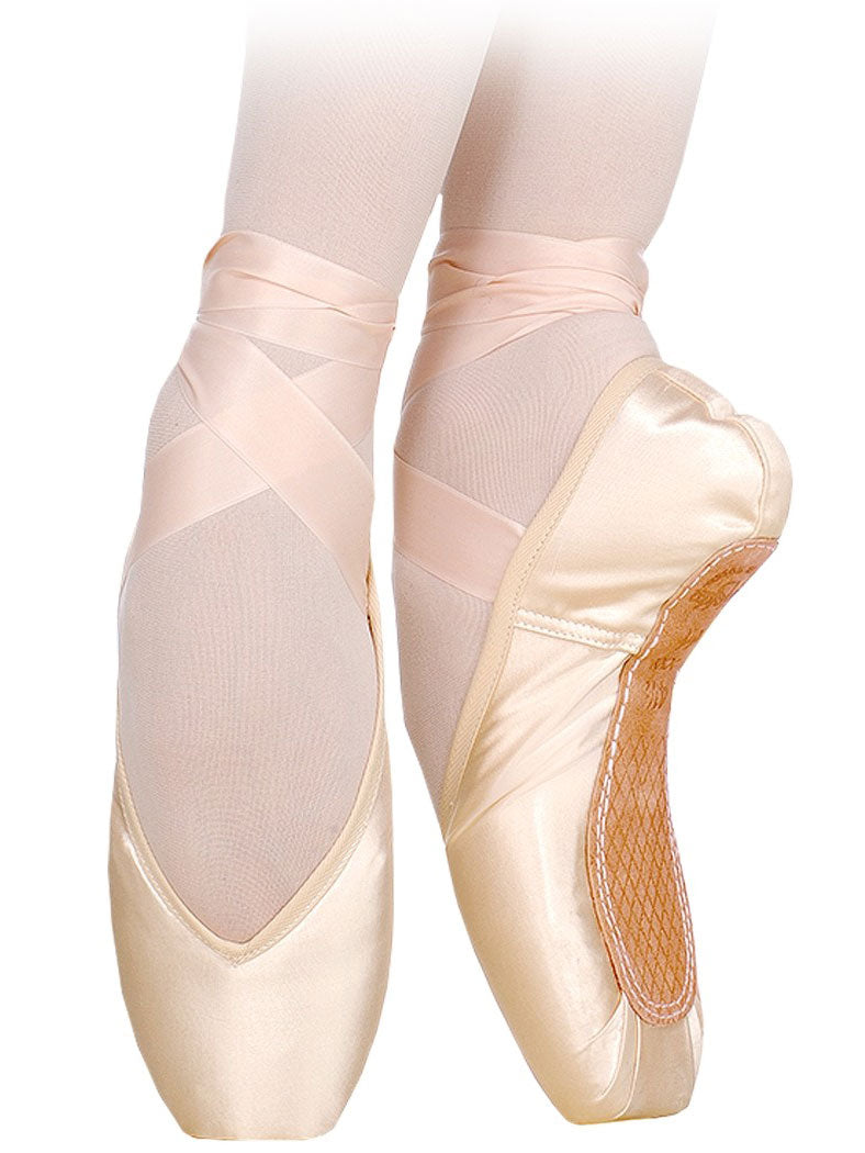 Ballet pointe shoes with pink ribbons on a white background