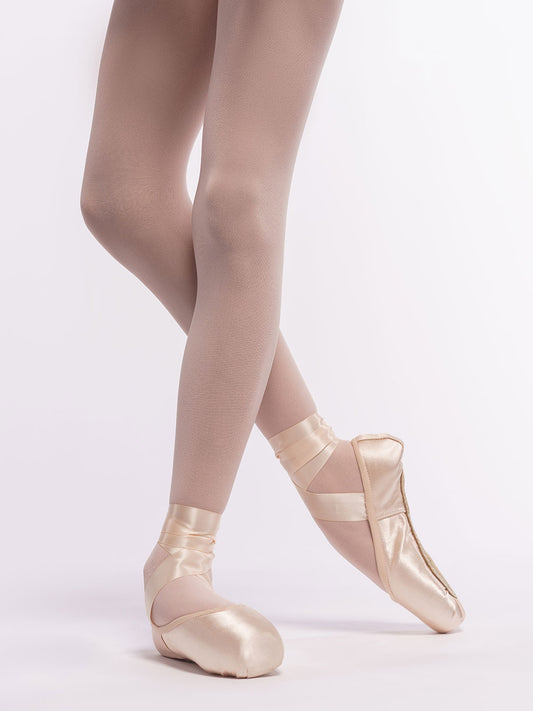 Ballerina wearing pointe shoes on a white background