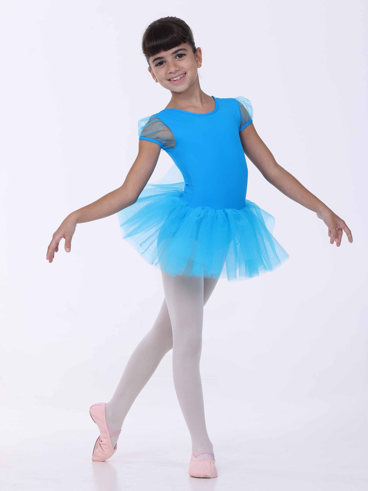 Child wearing a blue ballet dress on a white background