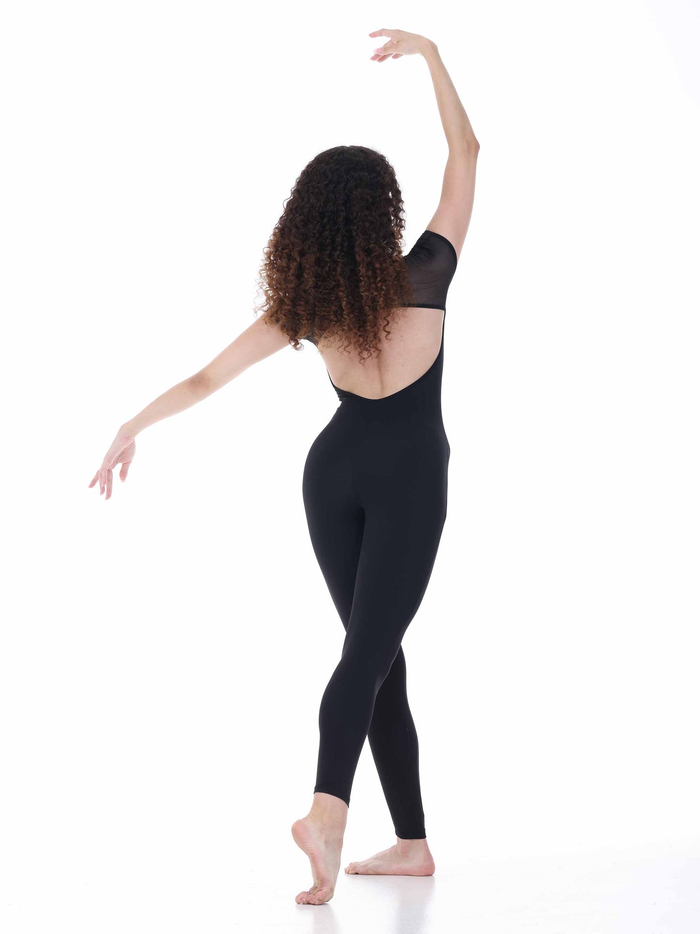 Dancer wearing black bodysuit on a white background