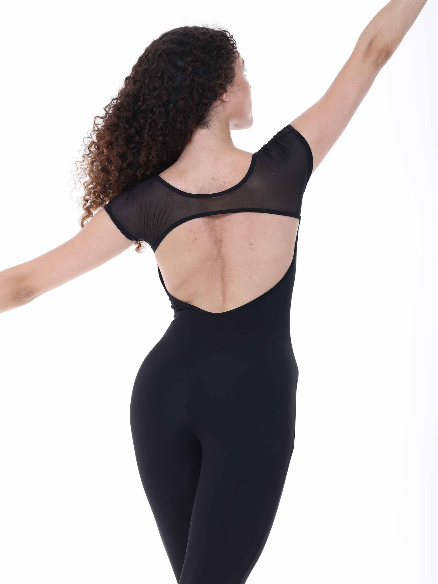 Black bodysuit worn by a model on a white background