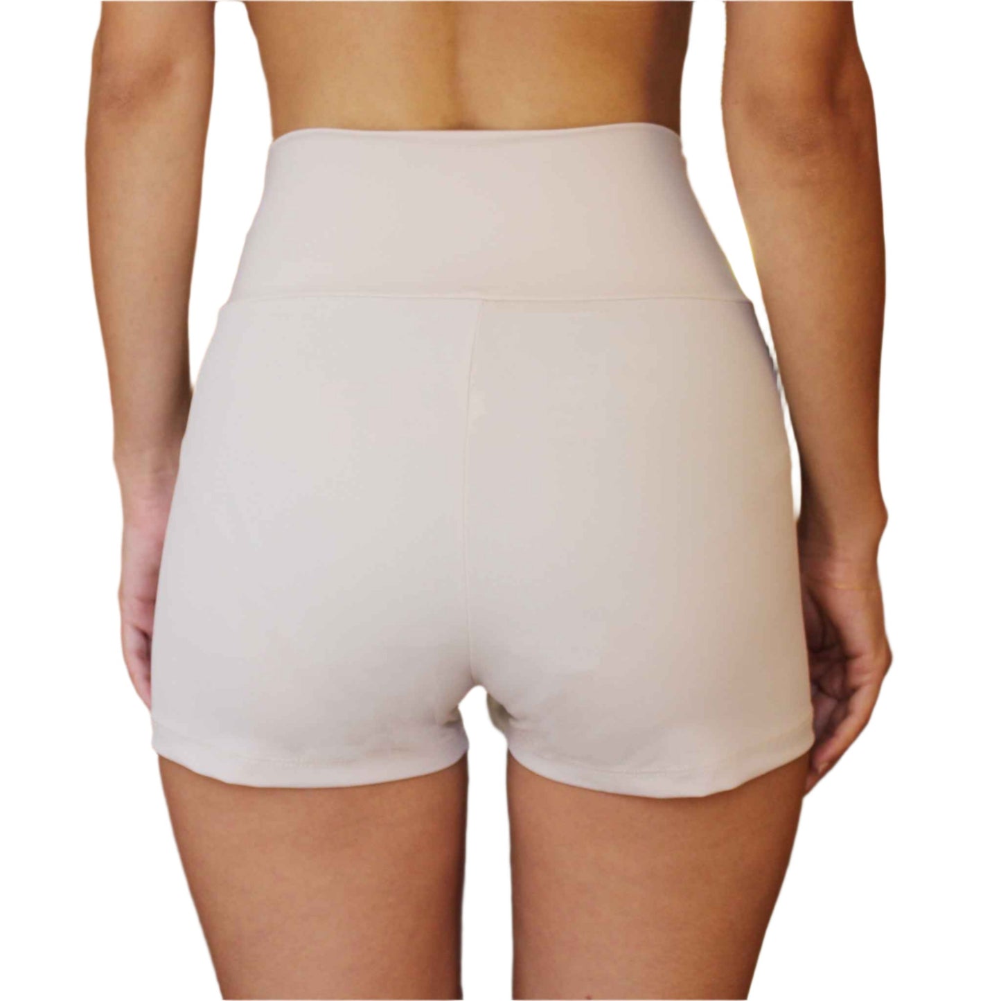 Beige high-waisted shorts worn by a person on a white background