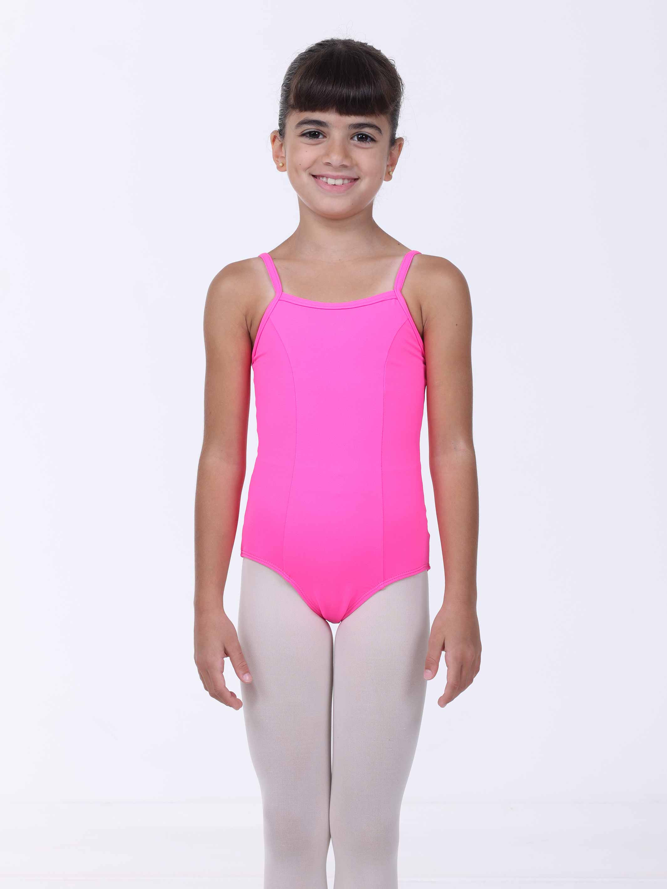 Young girl wearing a pink ballet leotard on a white background