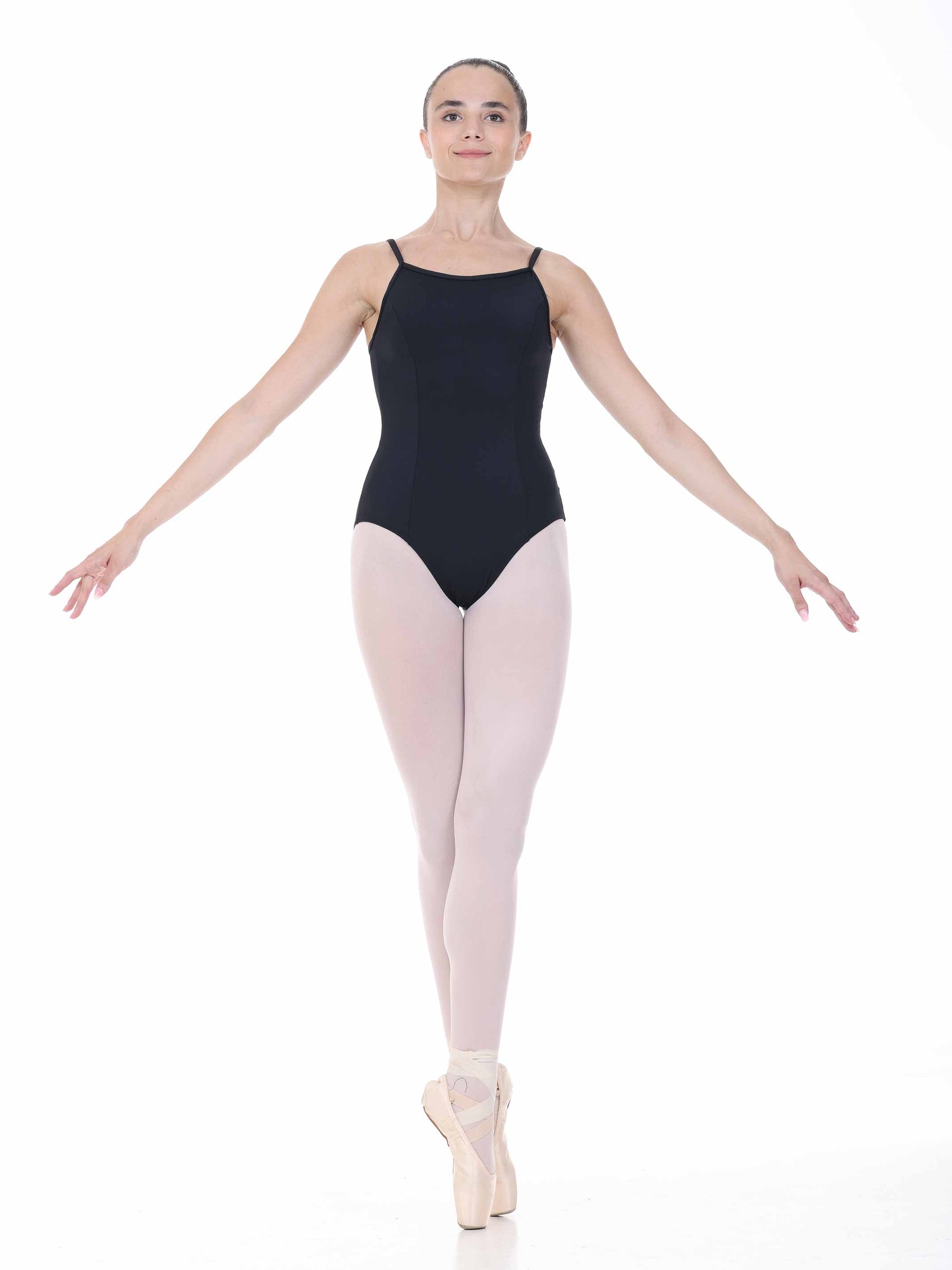 Ballerina in a black leotard and white tights on a white background