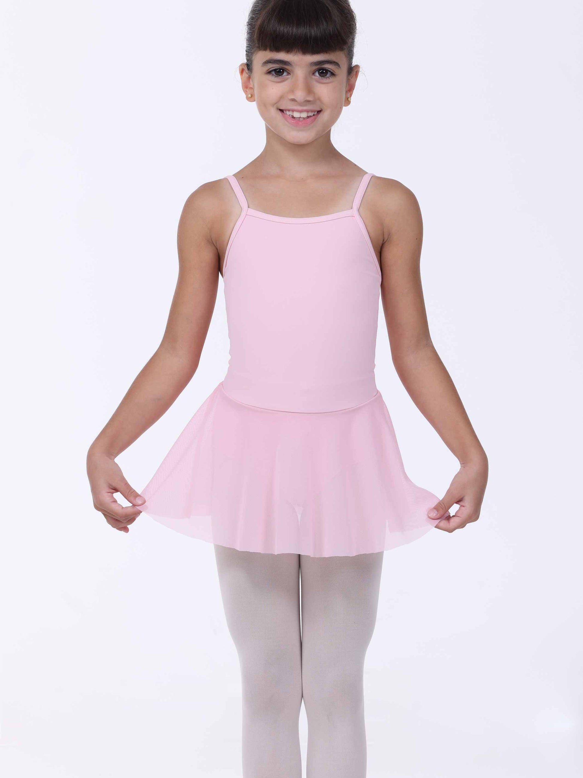 Young girl wearing a pink dress with a white background