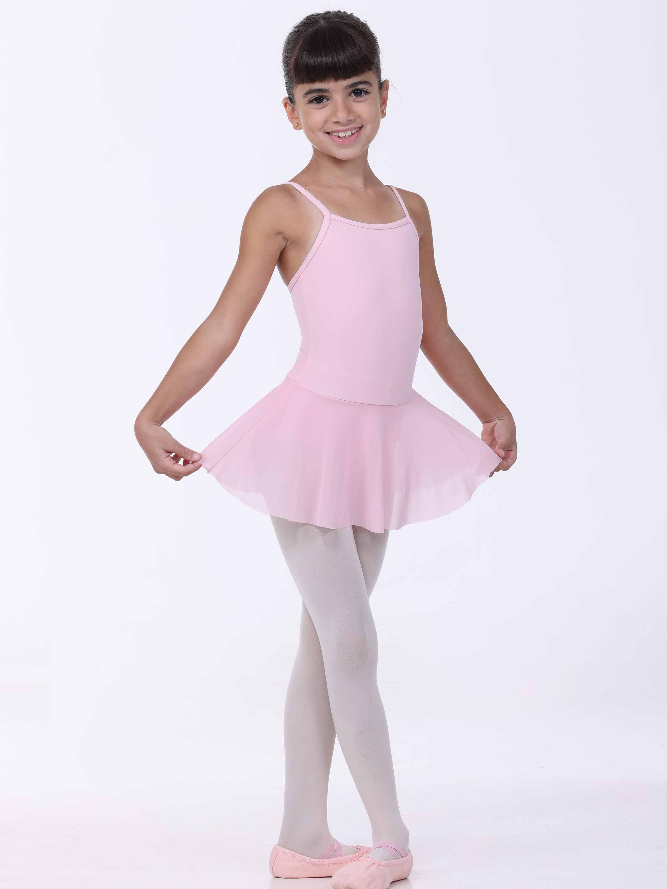 Young girl in a pink ballet dress and tights on a white background