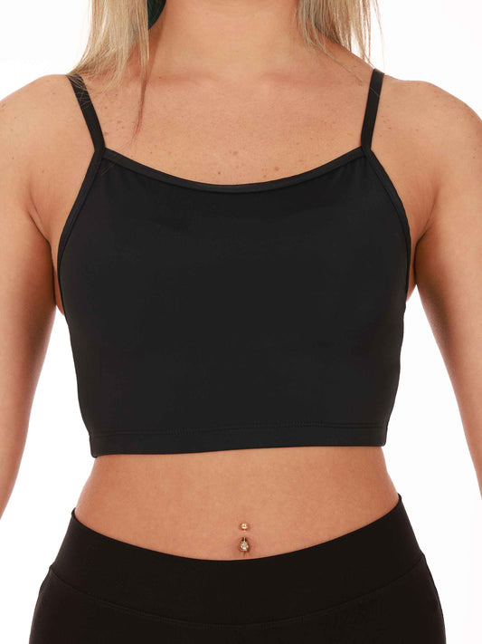Black sports bra worn by a person on a white background