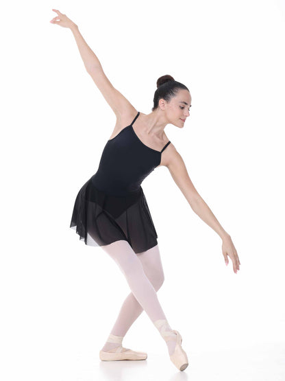 Ballerina in a black leotard and skirt on a white background