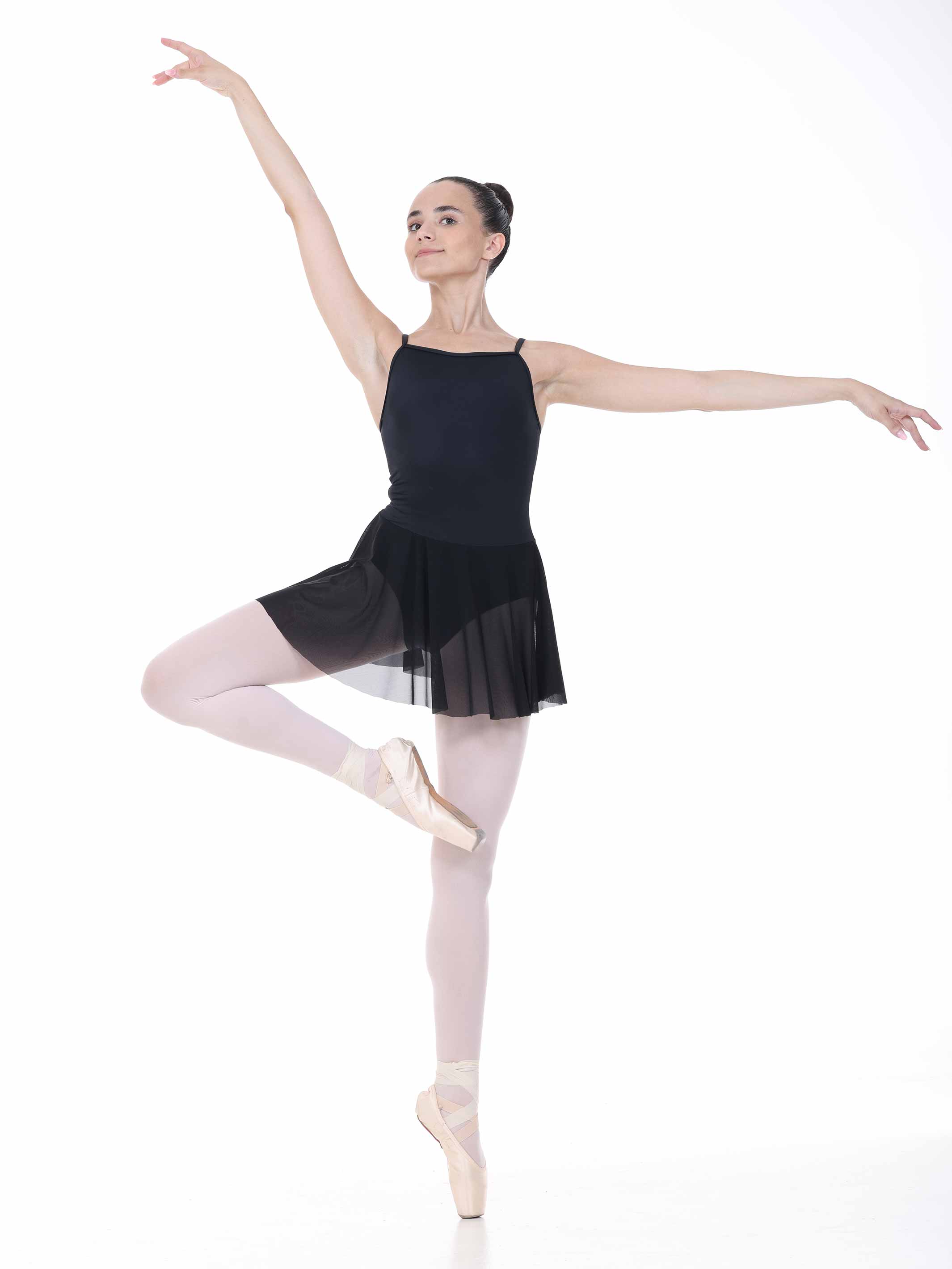Ballerina in a black ballet dress on a white background