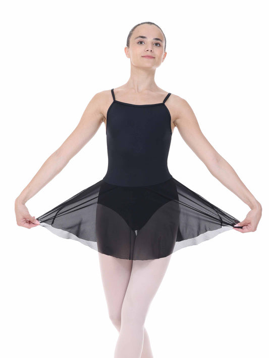 Ballerina wearing a black leotard with sheer overlay on a white background