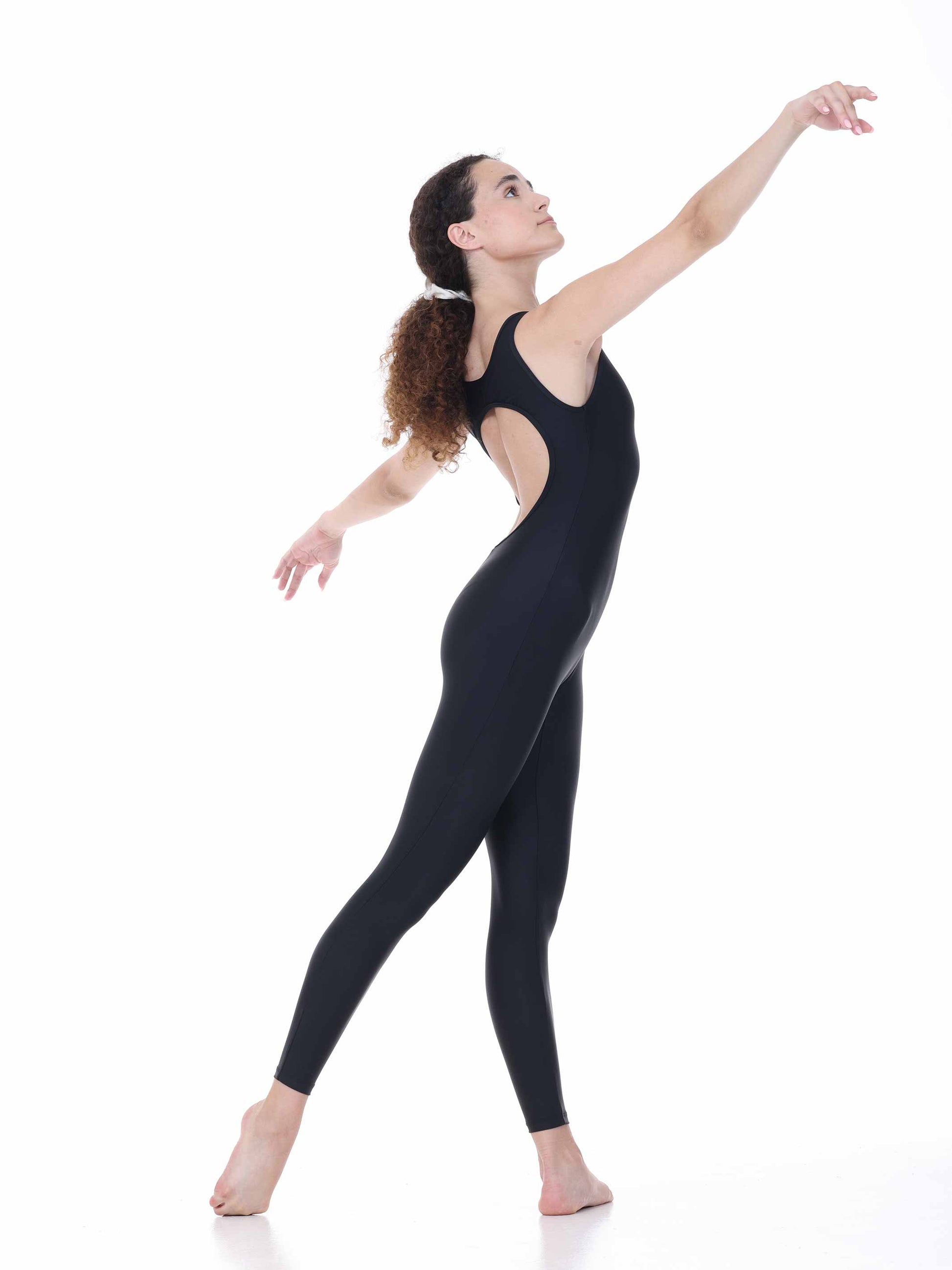 Dancer in a black unitard posing on a white background