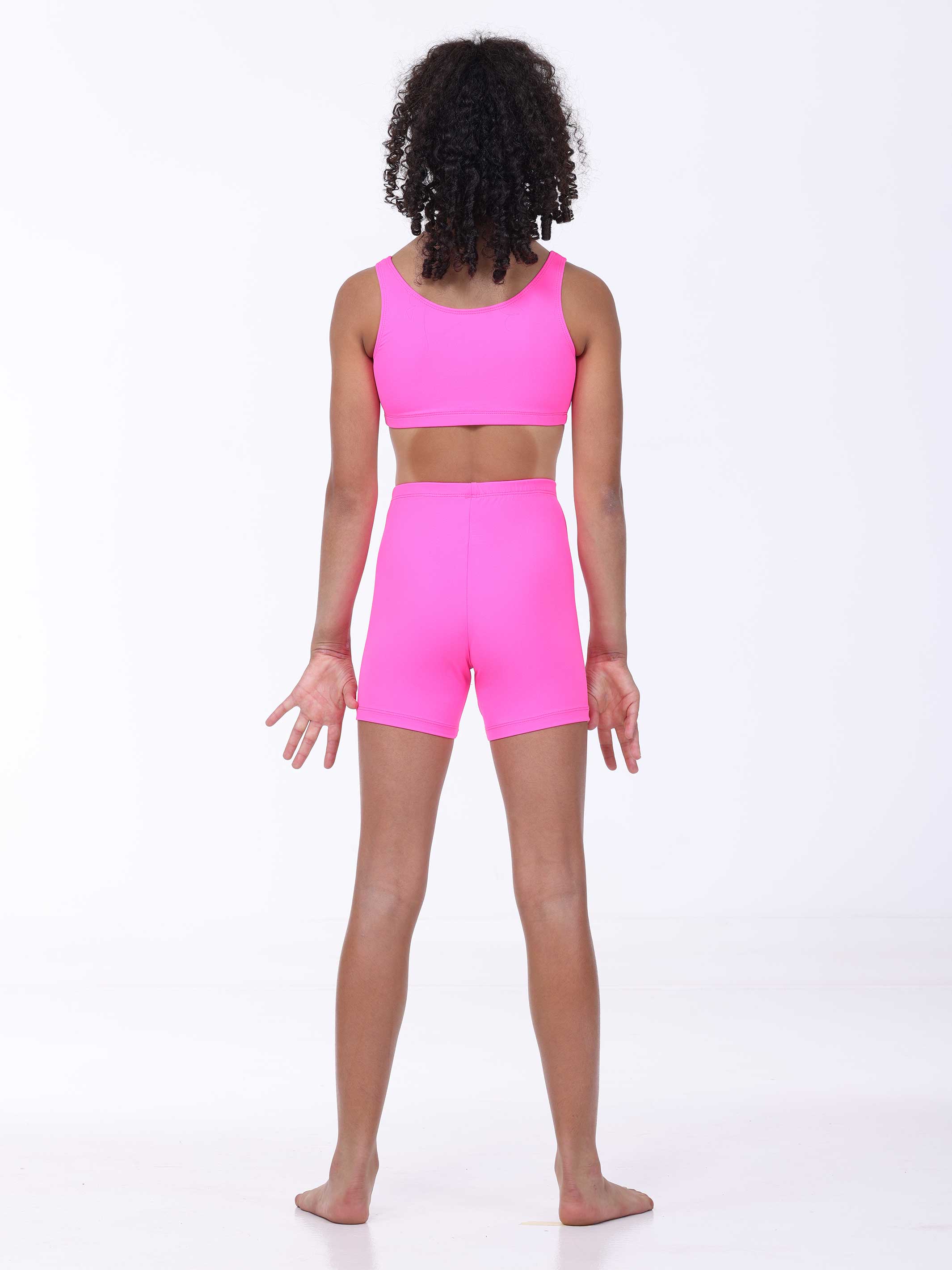 Person wearing a bright pink athletic outfit on a white background