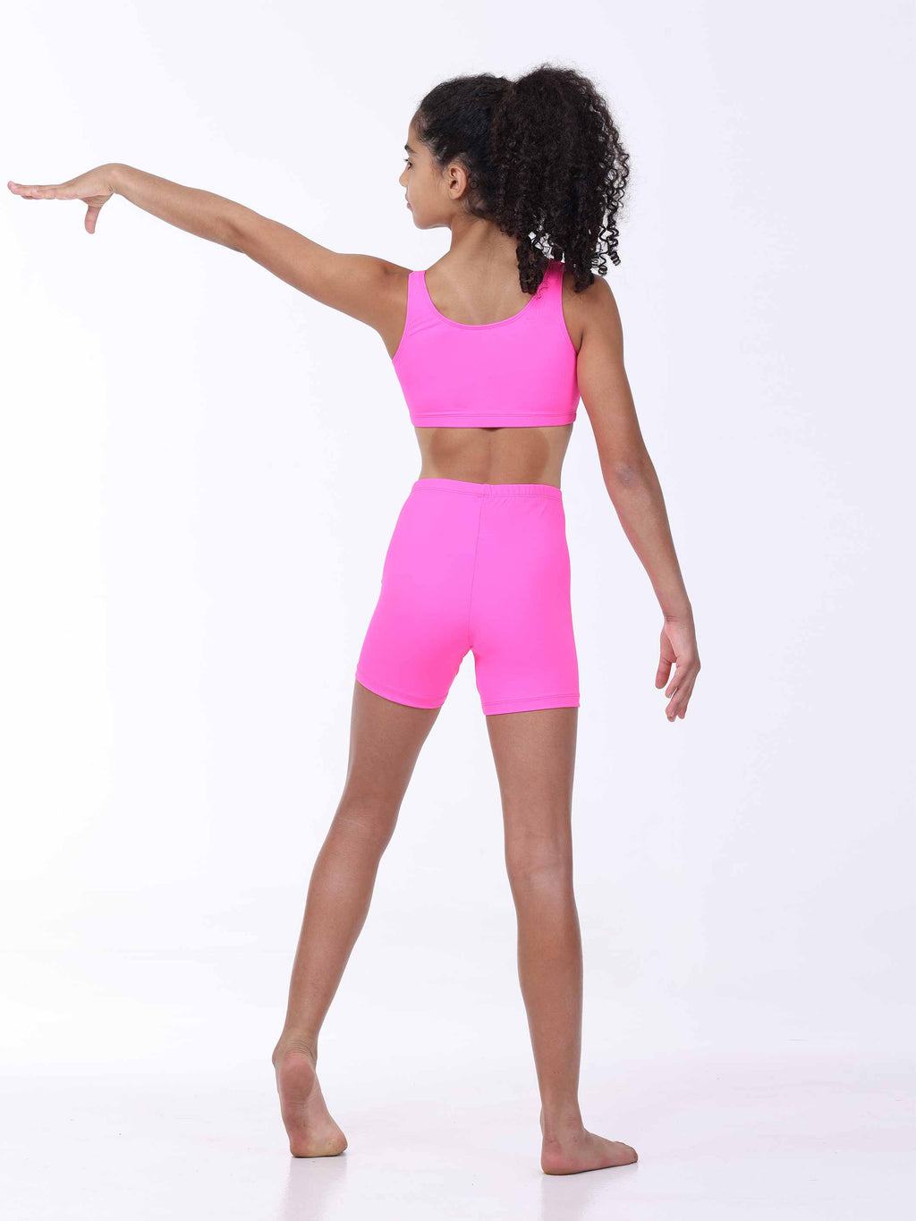Person wearing a bright pink athletic outfit on a white background