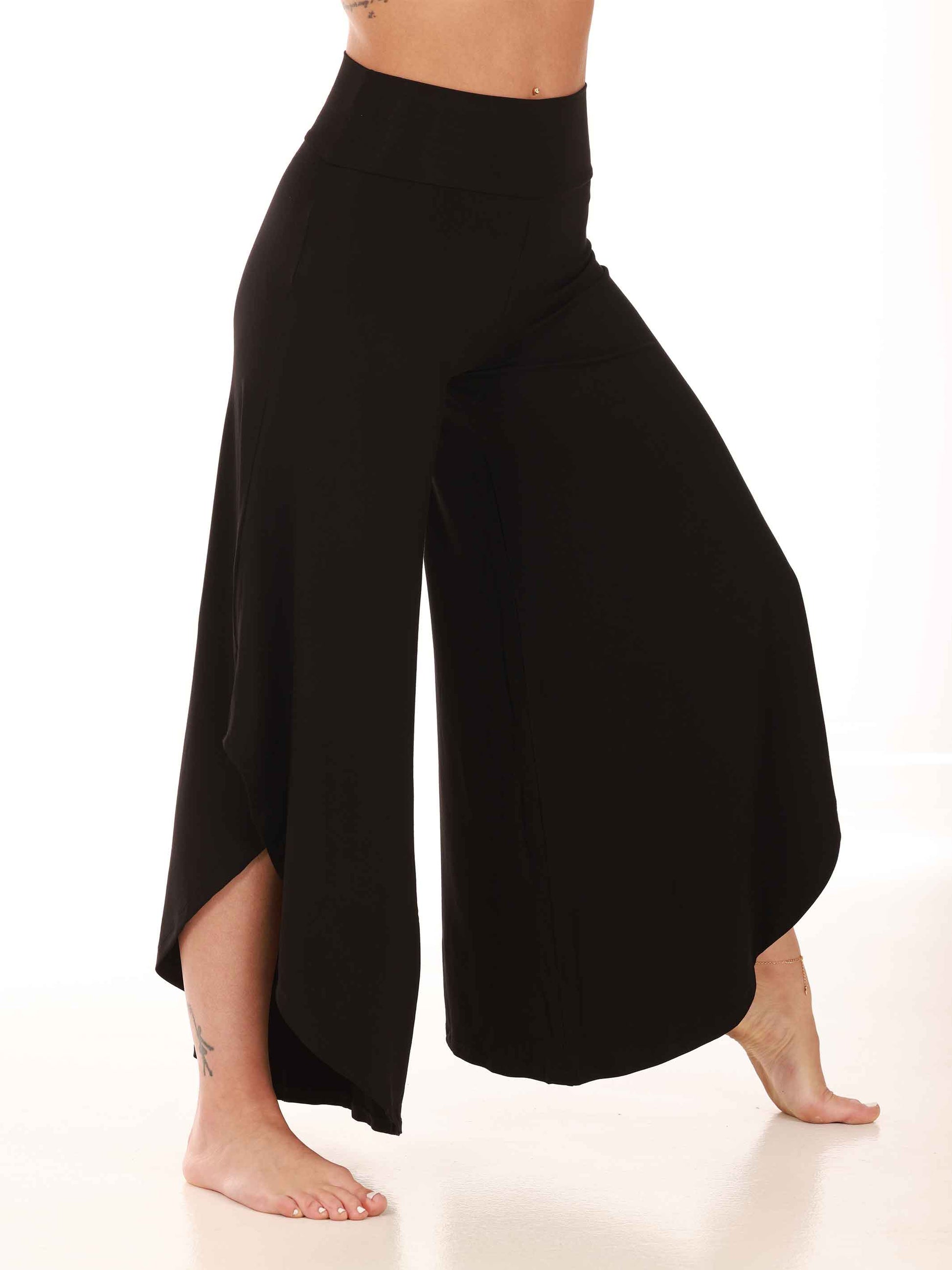 Black wide-leg pants worn by a person on a white background