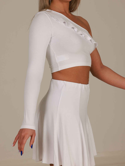 White one-shoulder top and skirt set on a neutral background