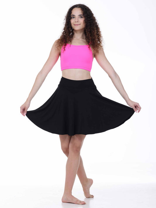 Woman wearing a pink top and black skirt on a white background