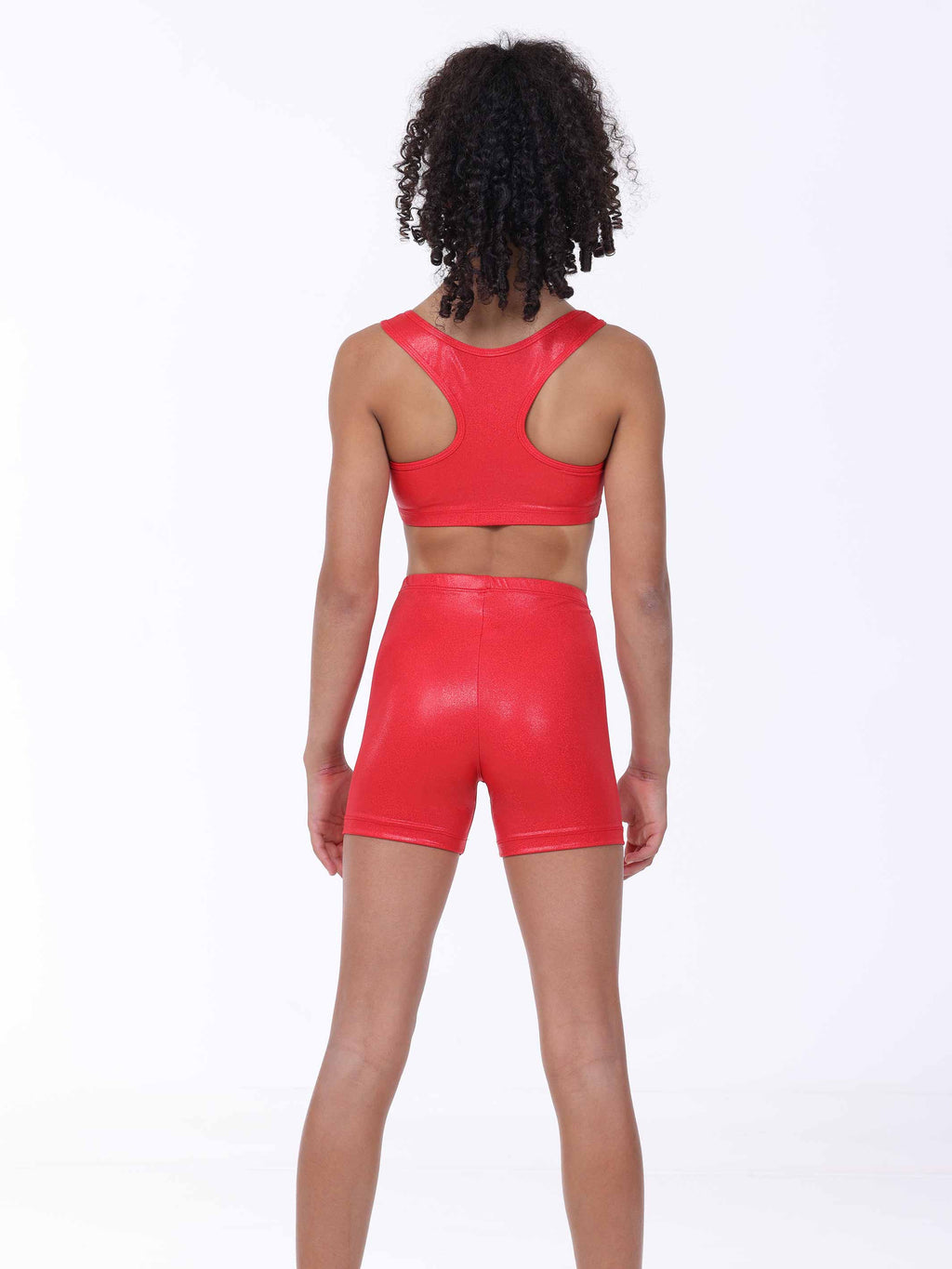 Person wearing a red sports bra and shorts set on a white background