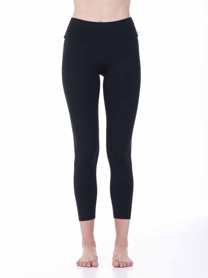 Black leggings worn by a person on a white background