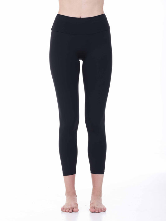 Black leggings worn by a person on a white background