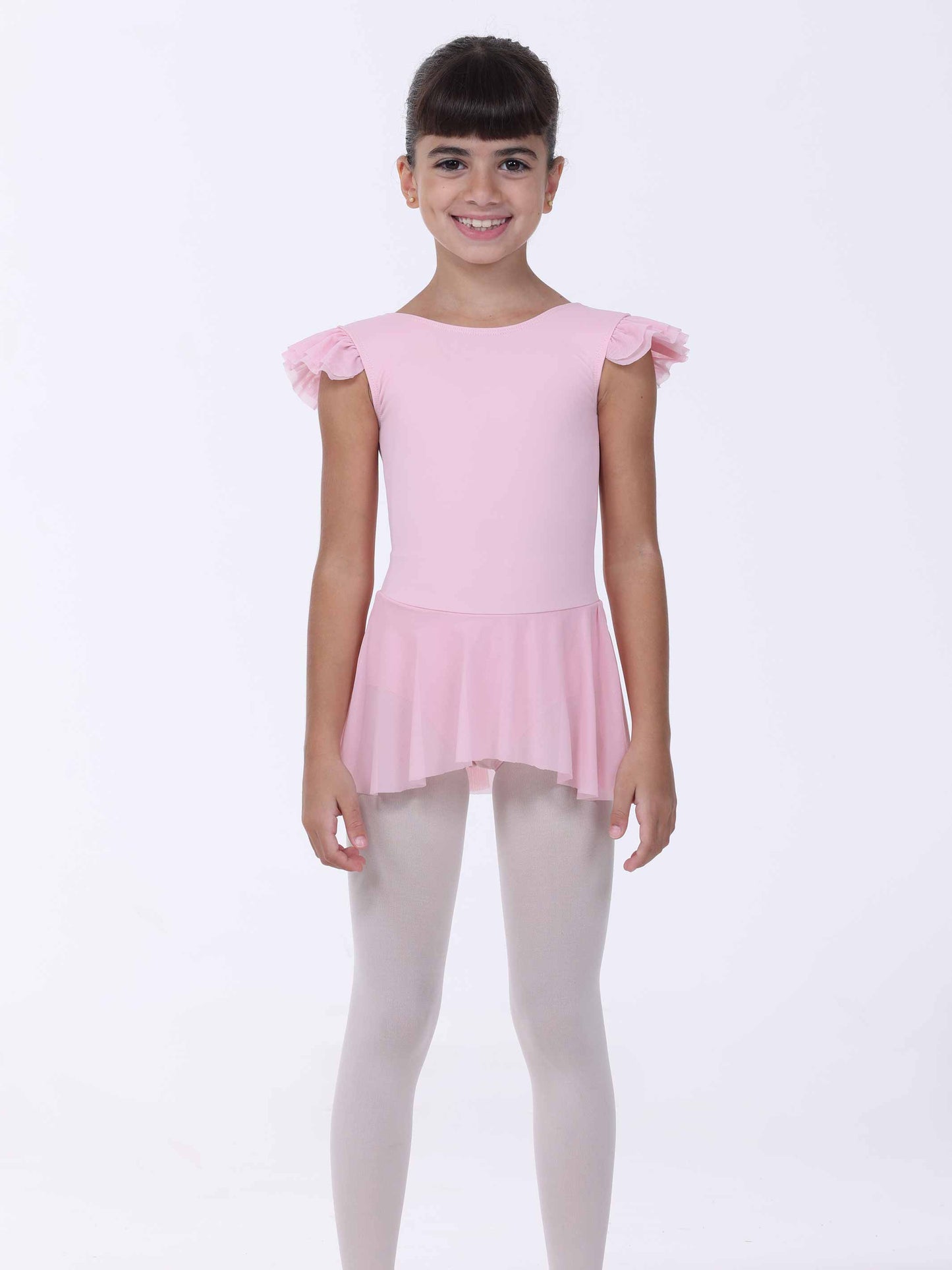 Young girl wearing a pink ballet dress with ruffled sleeves on a white background