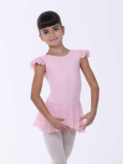 Young girl wearing a pink ballet dress with ruffled sleeves on a white background