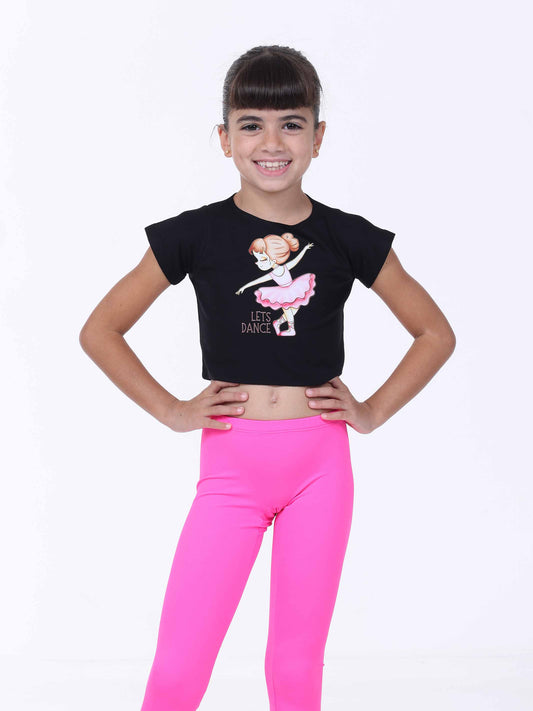 Girl wearing a black crop top with a graphic design and pink leggings on a white background