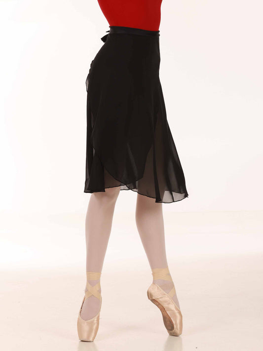 Ballerina wearing a long black chiffon skirt and red top