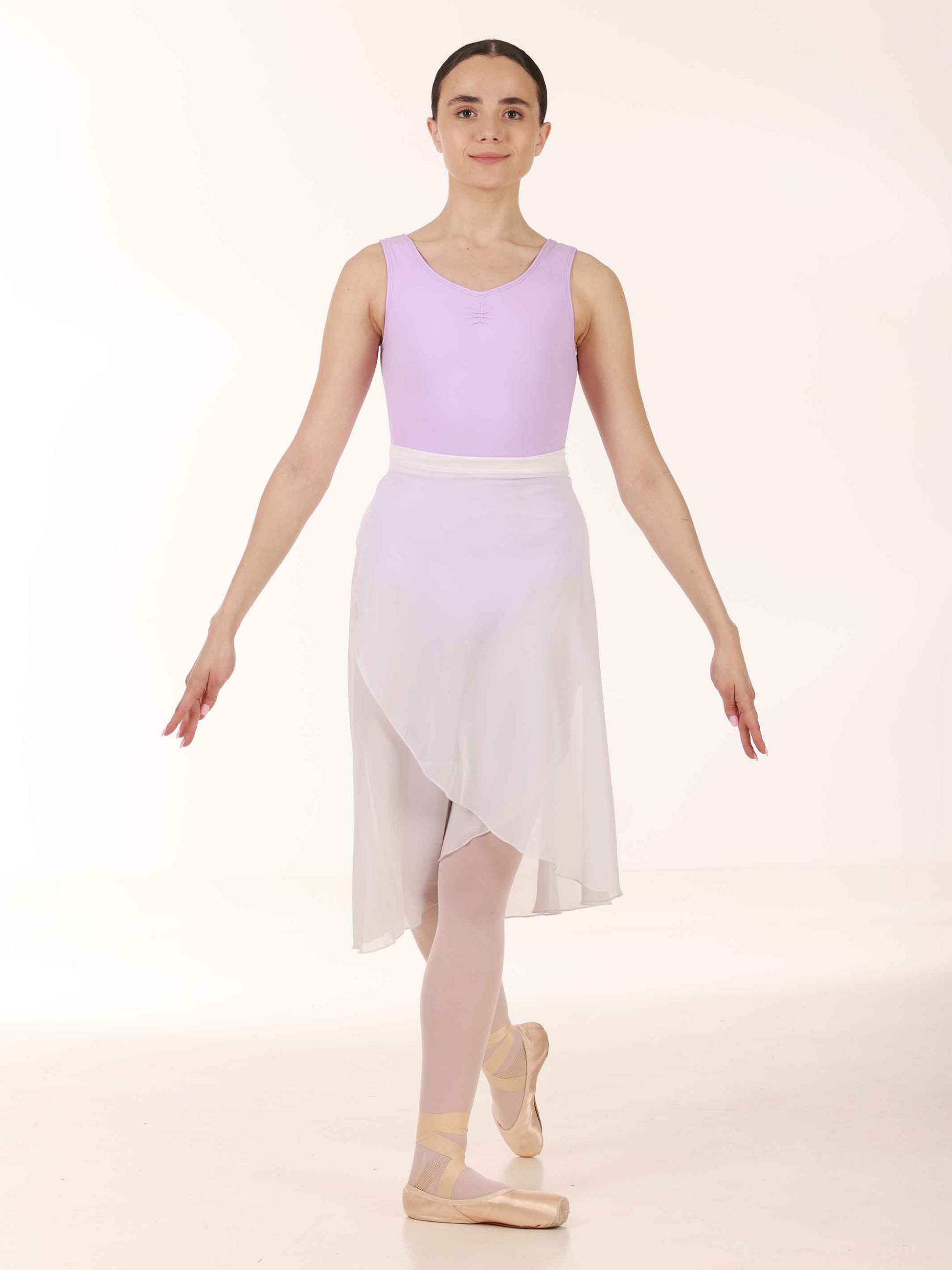 Ballerina wearing a long white chiffon skirt and lavender top