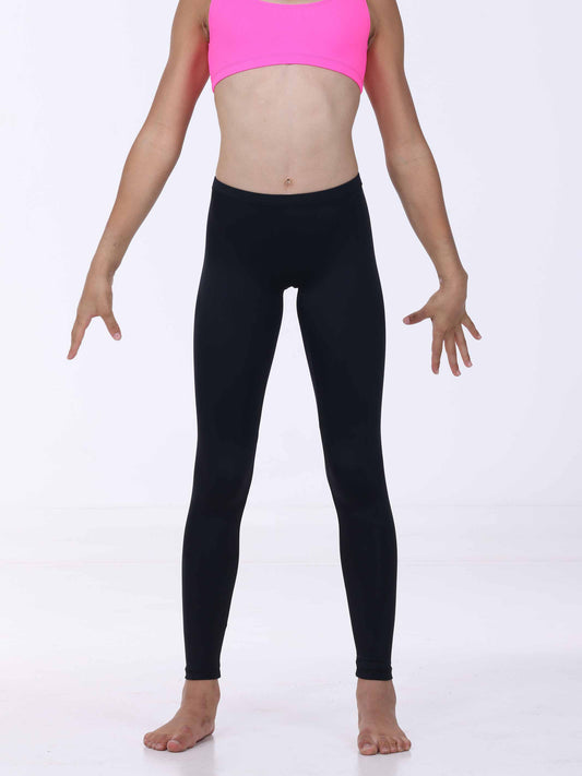 Person wearing black leggings and a pink top on a white background