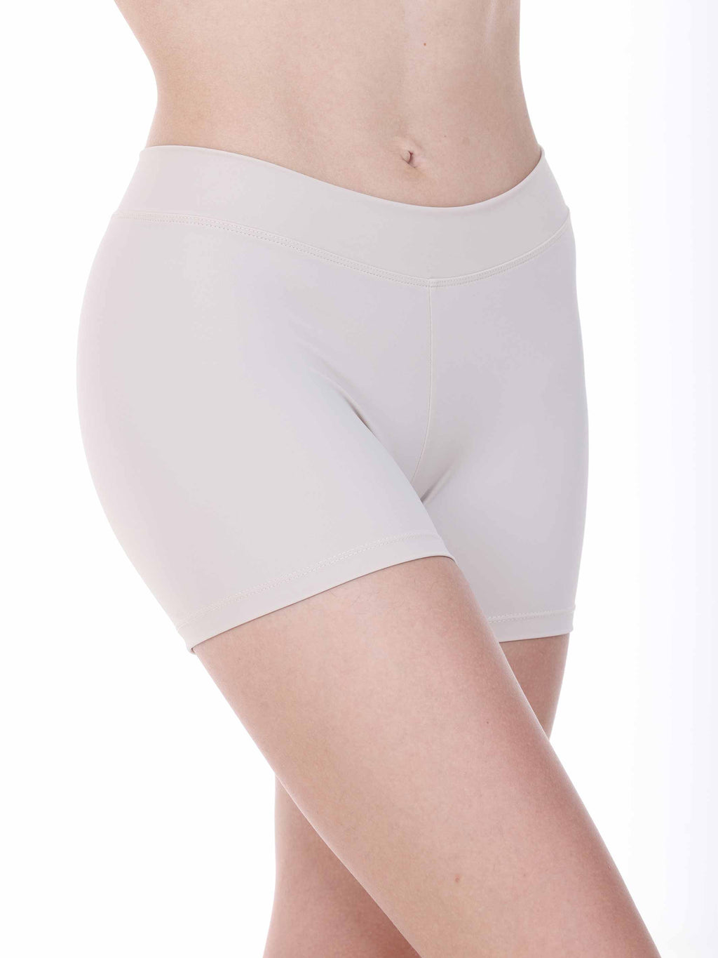 White dance shorts worn by a person on a white background