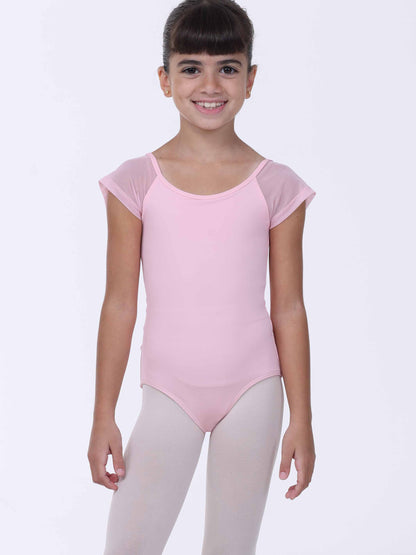 Young girl wearing a pink ballet leotard with sheer sleeves on a white background