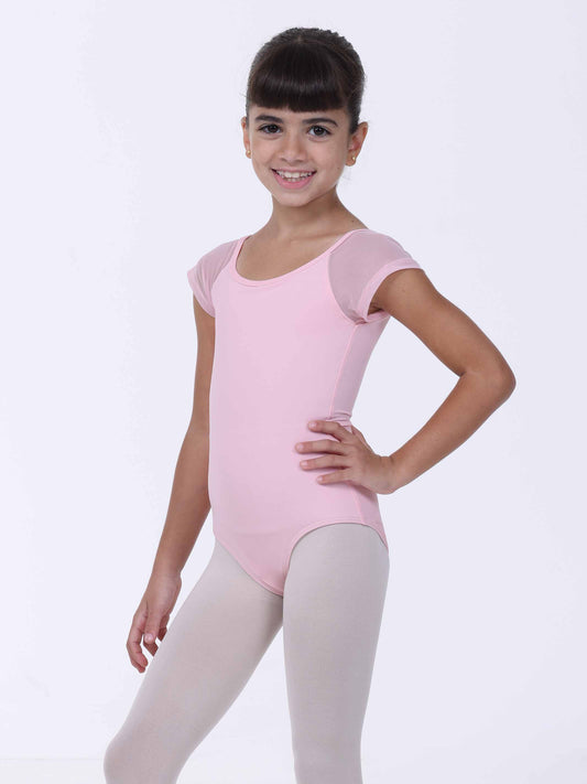 Young girl wearing a pink ballet leotard on a white background