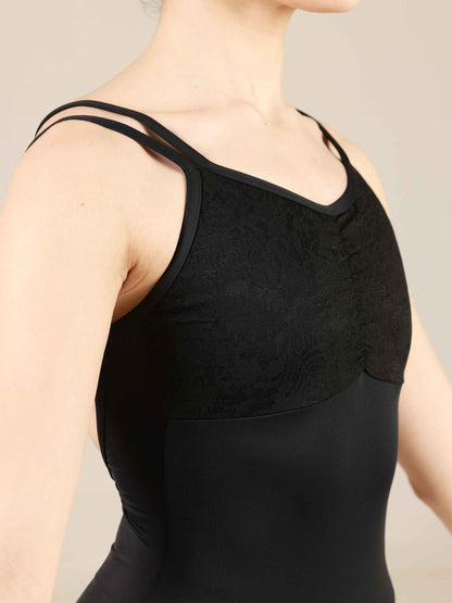 Black camisole leotard worn by a person on a neutral background