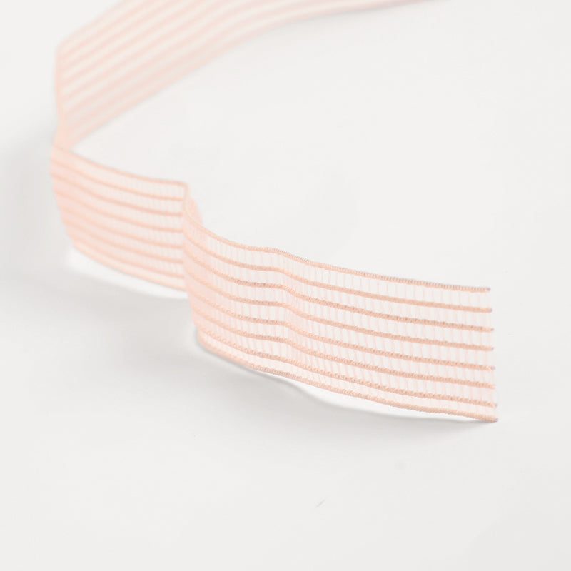 Light pink Elastic Ribbon for Pointe on a white background 