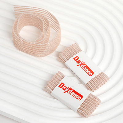 Pack of Elastic Ribbon for Pointe shoes on newspaper background