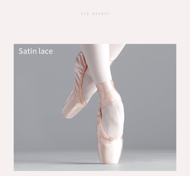 Ballerina in pink satin lace pointe shoes on a gray background