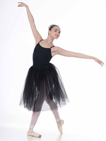 Ballerina in a black tutu posing on a white background