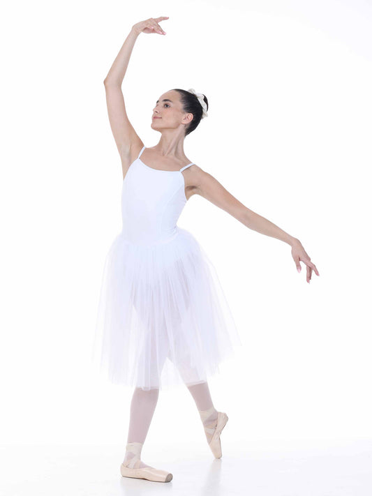 Ballerina in a white tutu dress posing on a white background