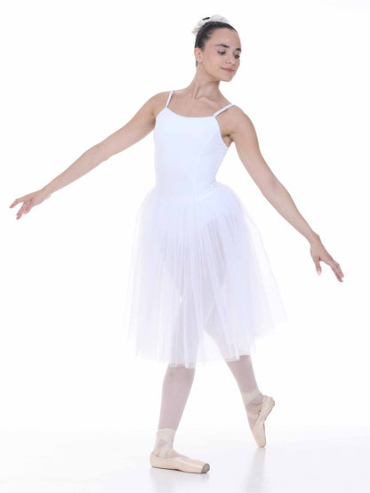 Ballerina in a white tutu dress and tights posing on a white background