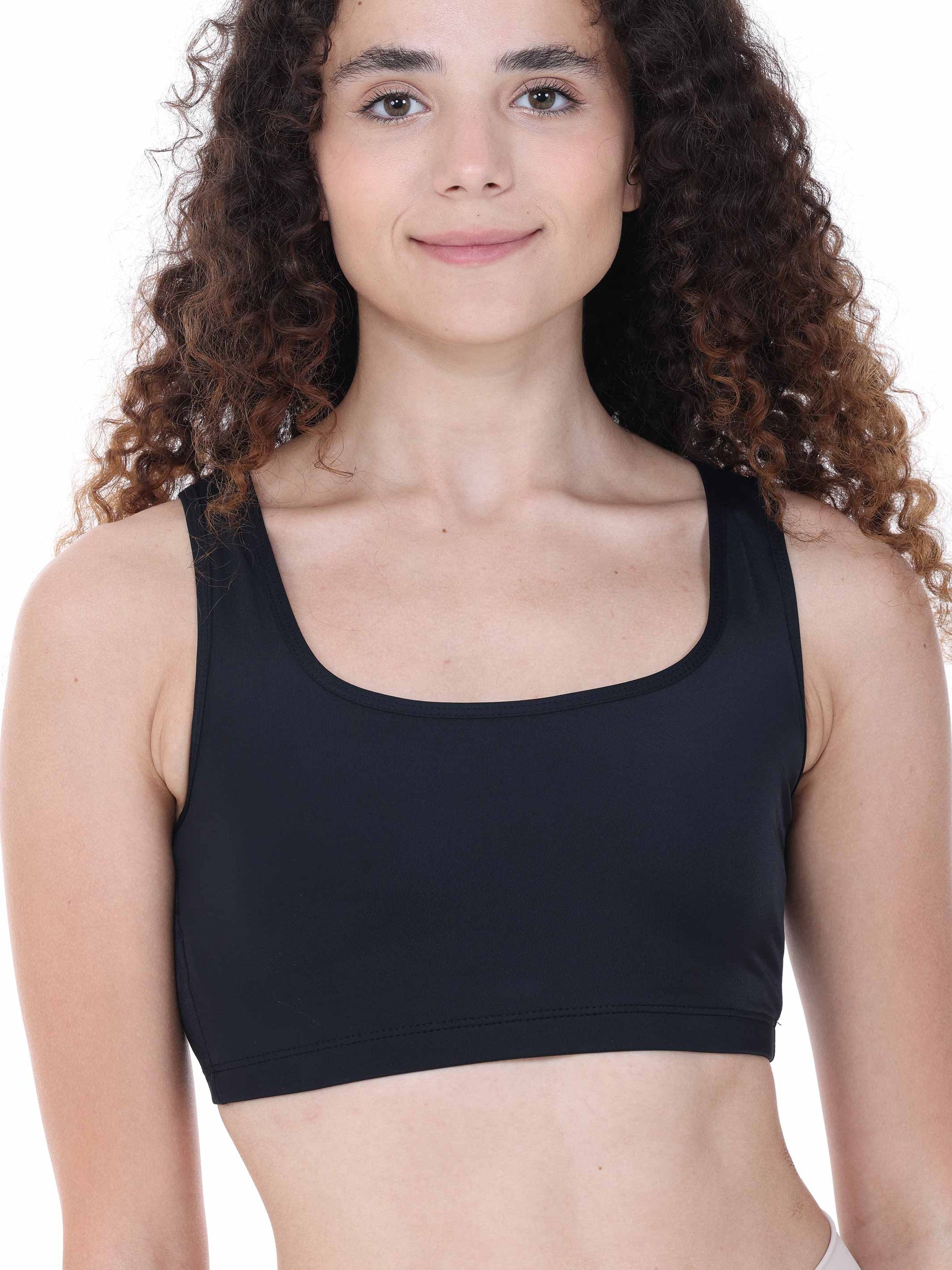 Person wearing a black sports bra on a white background
